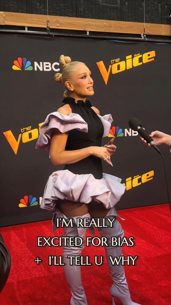 Gwen Stefani is in the stunning black halter dress with its light purple ruffled sleeves